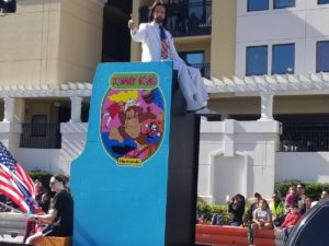 Mitchell rides an oversized <em>Donkey Kong</em> machine in the recent Citrus Bowl parade.