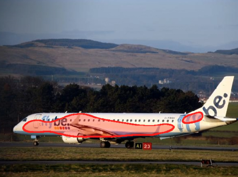 Photograph of a passenger jet with a sloppy computer-generated blob on the fuselage.