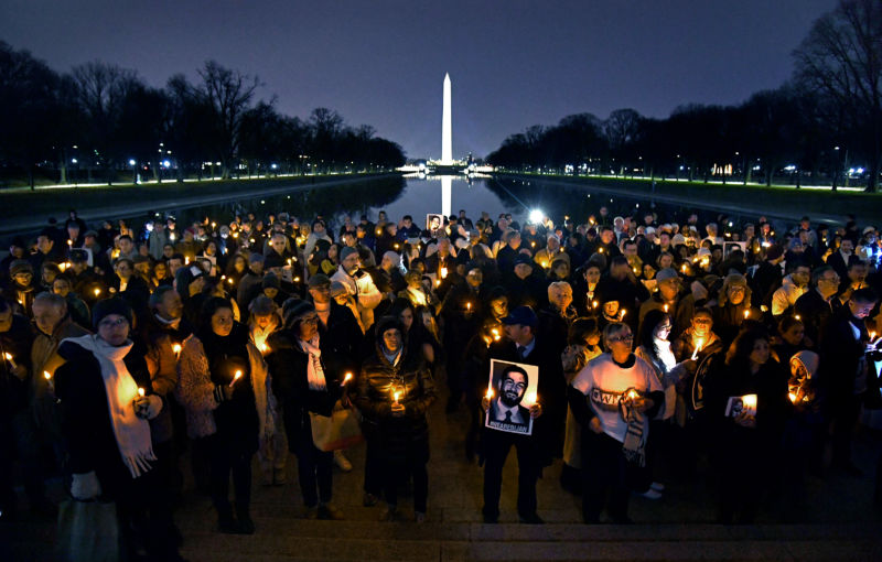 Holding candles and photos, friends and family gathered at the Lincoln Memorial to remember Bijan Ghaisar, on December 8, 2017. He was killed by US Park Police, and his family still does not know exactly why.