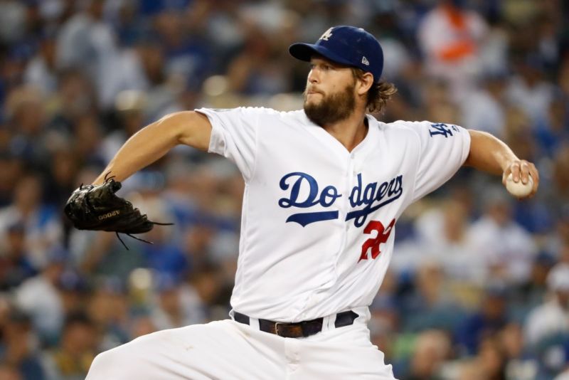 Los Angeles Dodgers pitcher Clayton Kershaw delivers the pitch during the first inning against the Boston Red Sox in Game Five of the 2018 World Series at Dodger Stadium.