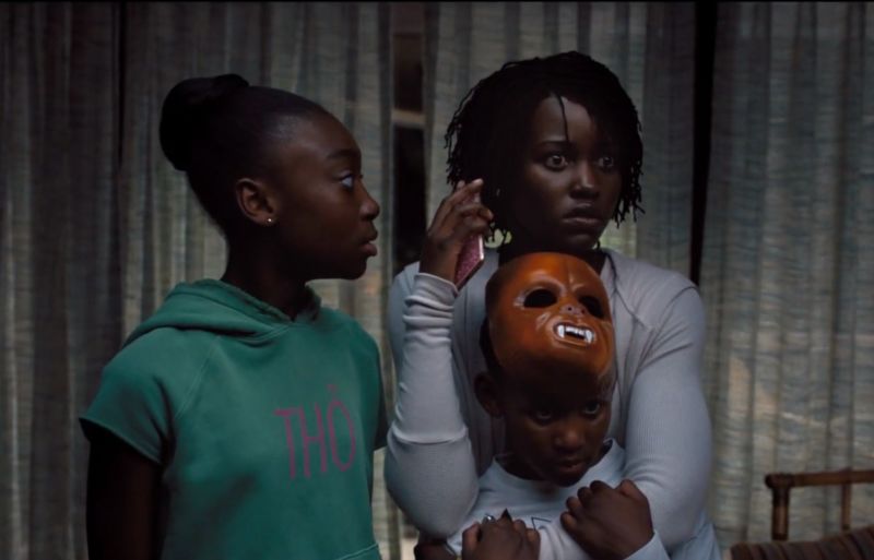 Adelaide (Lupita Nyong’o) tells her kids (Shahadi Wright Joseph and Evan Alex) to get their shoes on and be ready to run in <em>Us</em>.