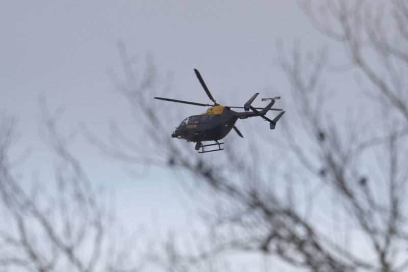 LONDON, ENGLAND - DECEMBER 20: A Police helicopter flies over Gatwick Airport as they search for the Drone operator causing closure of the airport on December 20, 2018.