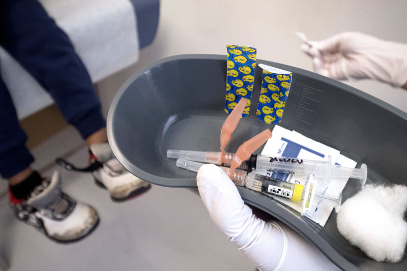 A nurse prepares to administer the measles, mumps, and rubella (MMR) vaccine as well as a vaccine used to help prevent the diseases of diphtheria, pertussis, tetanus, and polio at Children's Primary Care Clinic in Minneapolis, MN, Friday, April 28, 2017. 