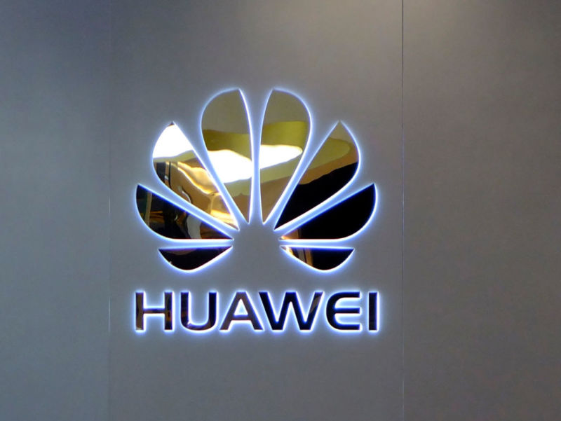 Huawei's corporate logo on a gray background.