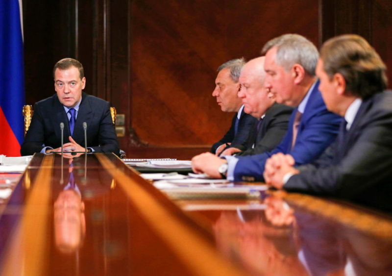 Russia's Prime Minister Dmitry Medvedev (L) during a meeting on financial and economic condition of the Roscosmos State Corporation on Wednesday.