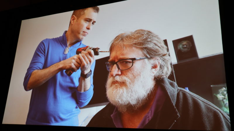 Valve Software's Mike Ambinder offers a joking photo of what people think his job as Principal Experimental Psychologist looks like. Valve co-founder Gabe Newell was not on hand to confirm or deny Valve's use of power tools on his head.