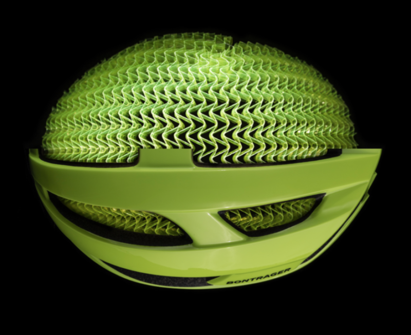 Image of a bike helmet cutaway to reveal a green mesh underneath.