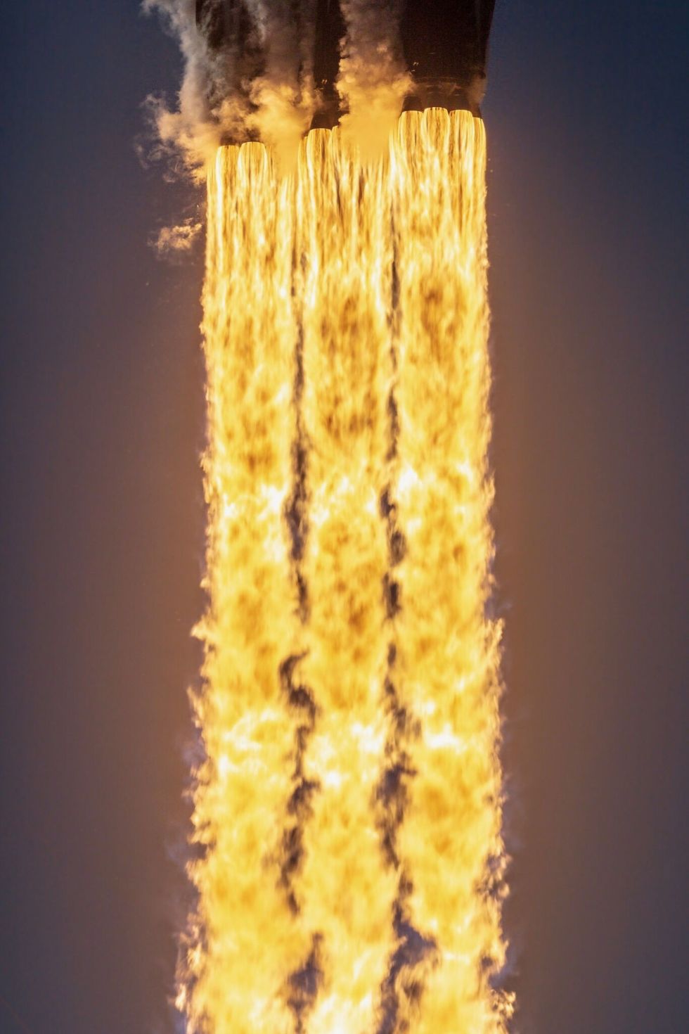 The Falcon Heavy fires its 27 engines on the way to space.