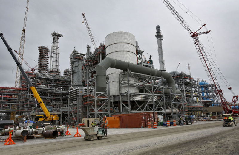 Cranes stand at the construction site for Southern Co.'s Kemper County power plant near Meridian, Miss., on Tuesday, Feb. 25, 2014.