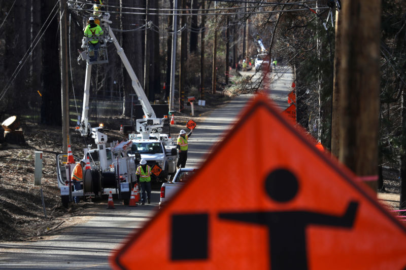 workers rebuilding power lines in California.