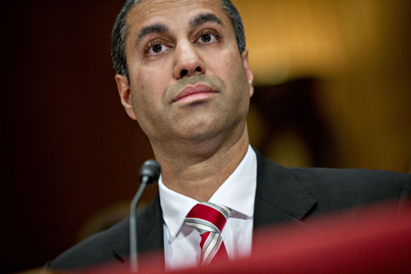 FCC Chairman Ajit Pai listening at a Senate hearing.