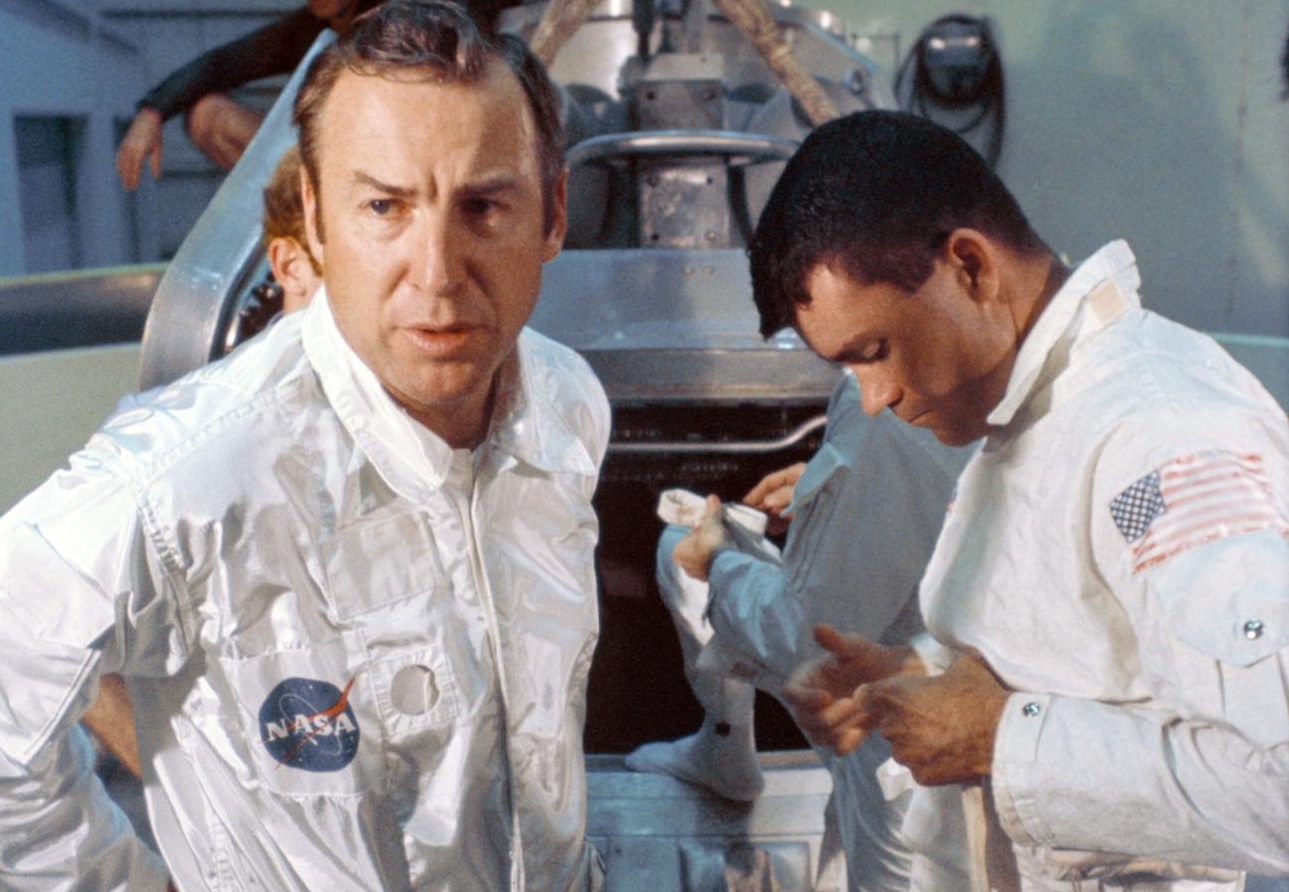 Mission commander James A. Lovell Jr., (left) and lunar module pilot Fred W. Haise Jr., (right) prepare to participate in water egress training.