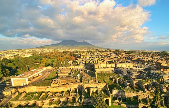 An aerial view of Pompeii, with Mt. Vesuvius still presiding over the scene.