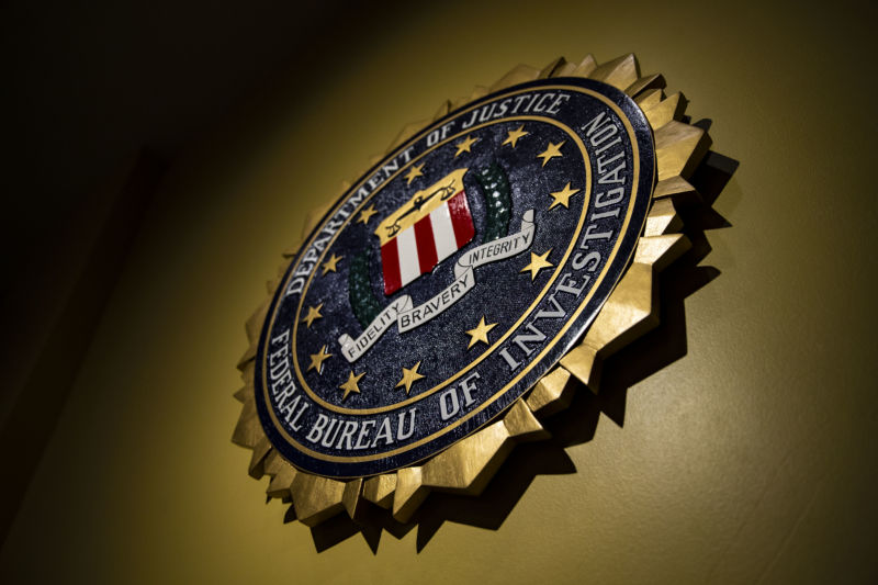 FBI seal hangs on a wall.