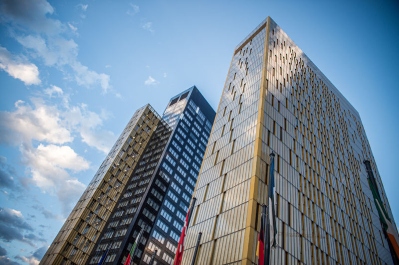 Photographed of glass-walled skyscrapers.