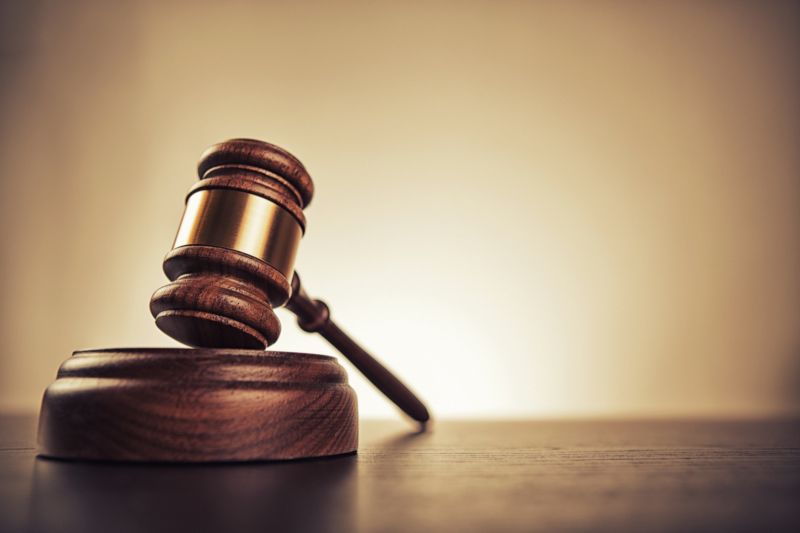 A judge's gavel on a desk.