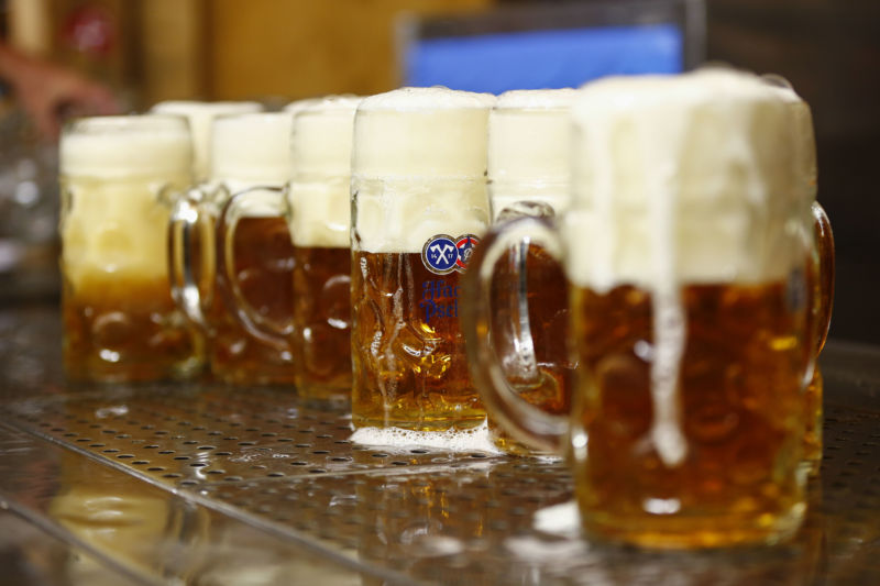 Pints of frothy beer sit on a bar at the Oktoberfest in Munich, Germany, on Thursday, Sept. 26, 2019. 