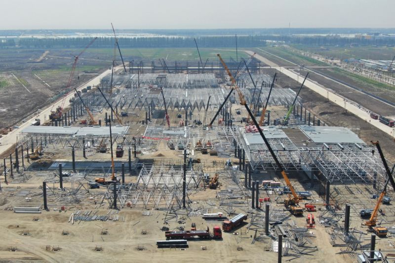 An aerial view of the construction site of Tesla's manufacturing facility is seen on April 8, 2019 in Shanghai. The factory is expected to begin production before the end of 2019, which could help Tesla meet its goal to deliver at least 360,000 vehicles for the year.