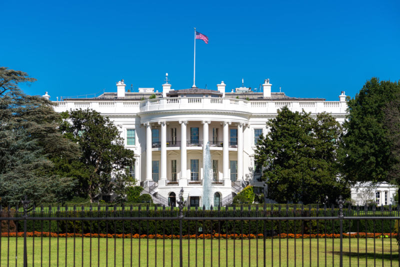 Photograph of the White House on a sunny day.