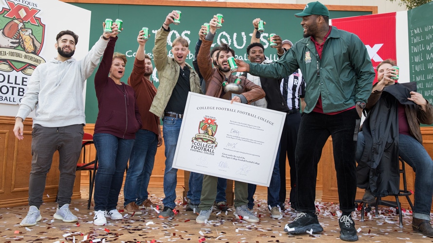 Football star Martellus Bennett and fans group photo at the Dos Equis College Football Football College Bowl Game