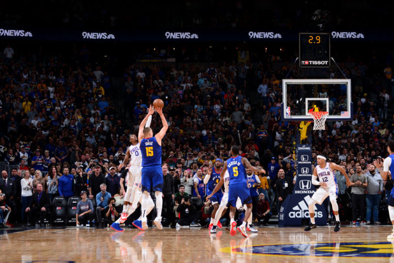 Nikola Jokic of the Denver Nuggets basketball team makes a game-winning shot from just inside the 3-point line.