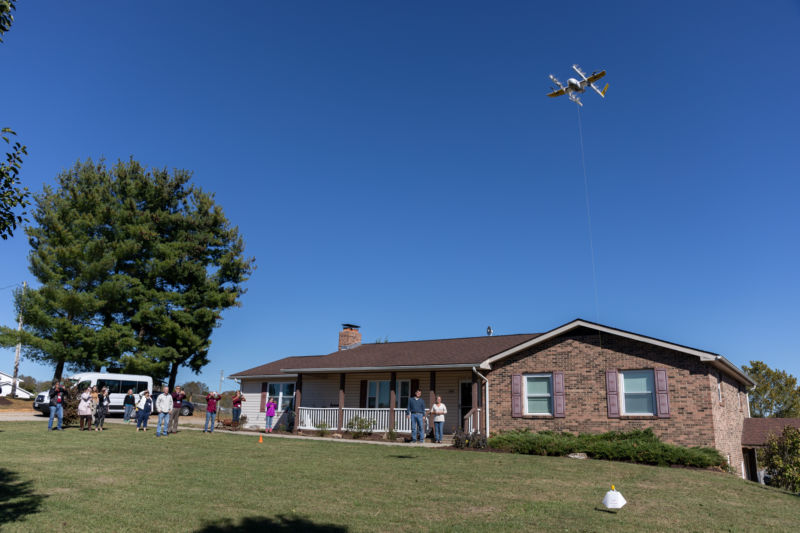 Wing Aviation, a "moonshot" project of Google's Alphabet, delivers a package to a customer in October 2019. Wing was the first drone operator sanctioned by the FAA to deliver packages to customers, but a large scale deployment of technology like this depends on better location tracking systems.