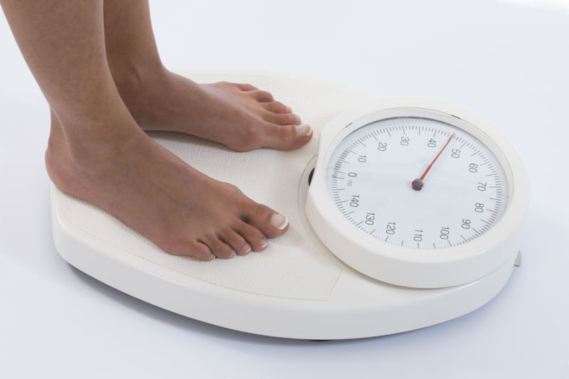 Woman on kg weight scale 