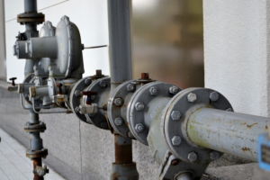 Pipe segments are often fit together with bolts through round flanges, as seen here. If you've never done pipefitting work, getting things to line up is more difficult than you might think.