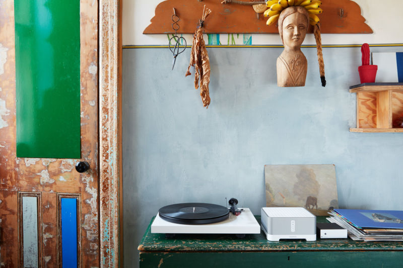 Promotional image of record player in bohemian studio.