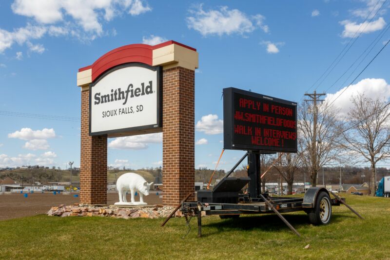 A sign outside the Smithfield Foods pork processing plant, one of the country's largest known Coronavirus clusters, is seen on April 21, 2020 in Sioux Falls, South Dakota.