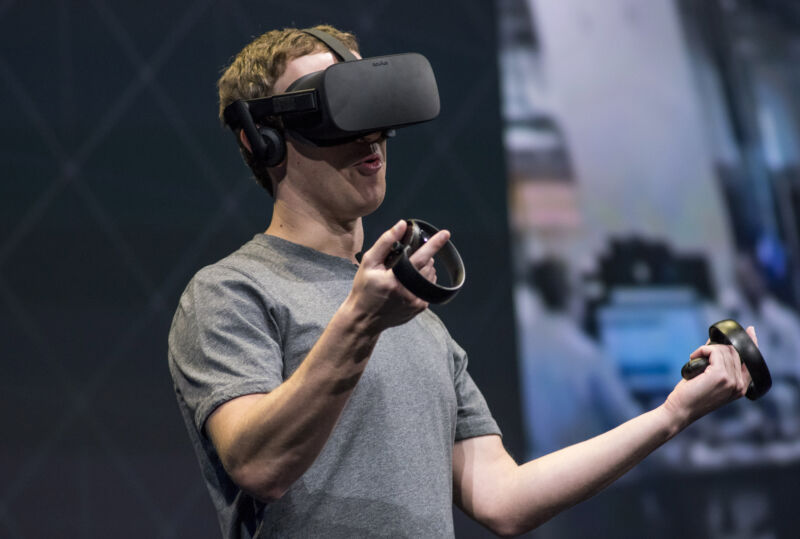 Mark Zuckerberg demonstrates an Oculus Rift headset at a 2016 event.