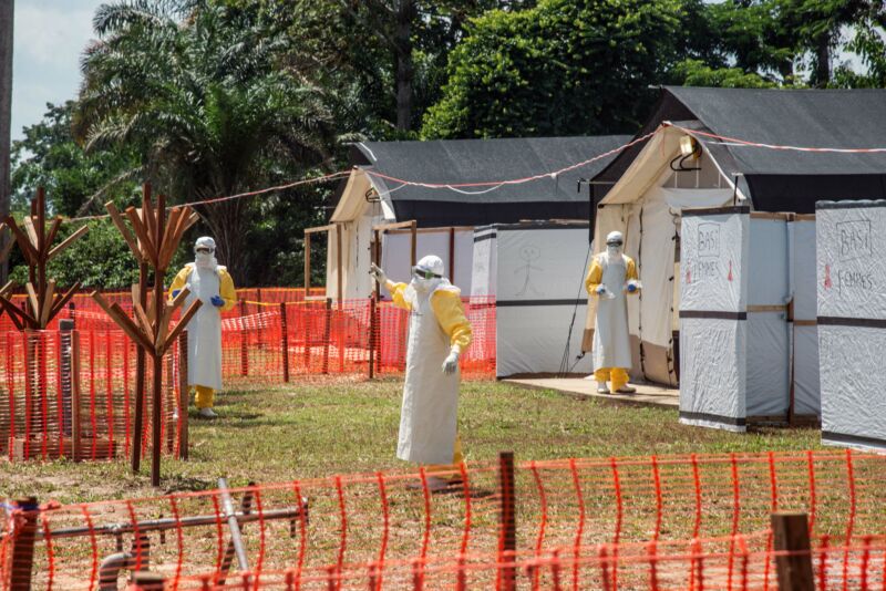 Health workers operate within an Ebola safety zone in the Health Center in Iyonda, near Mbandaka, on June 1, 2018. 