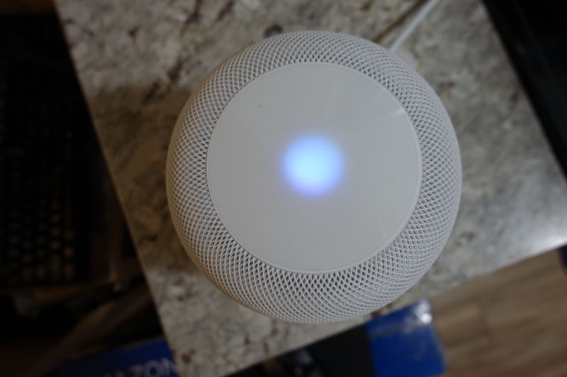 Activating Siri on an Apple HomePod speaker.