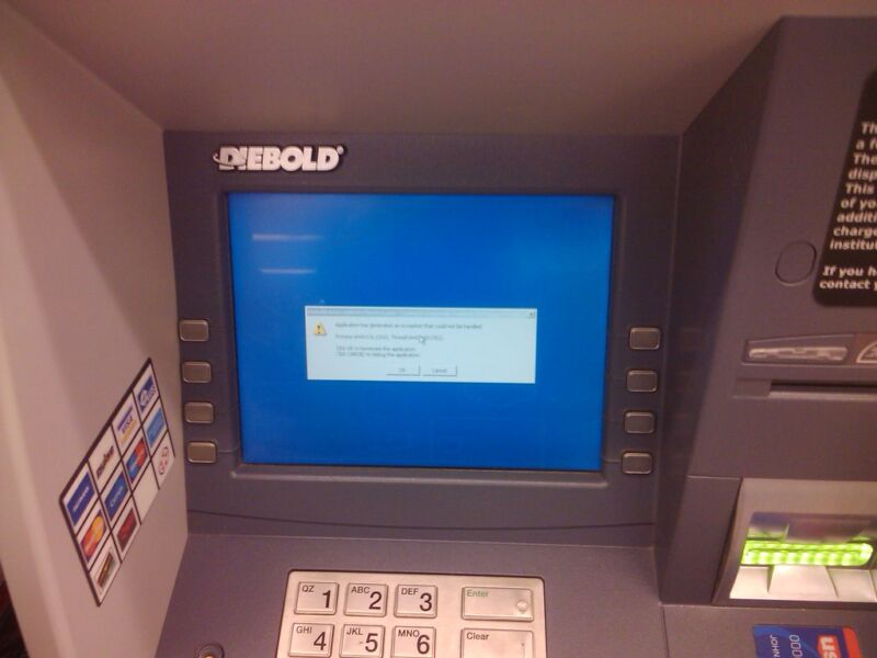 A warning appears on the screen of a Diebold ATM.