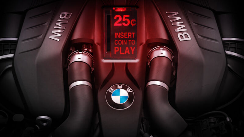 A BMW-branded engine has been photoshopped to include an arcade game-style coin slot.