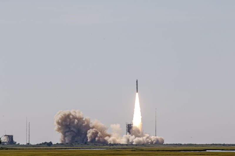 Smoke billows behind a rocket as it lifts off.