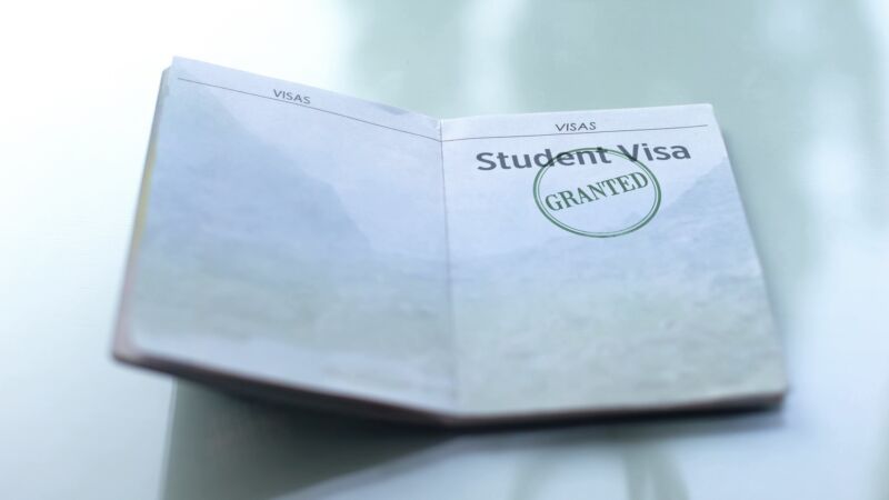 A student visa stamped with the word 