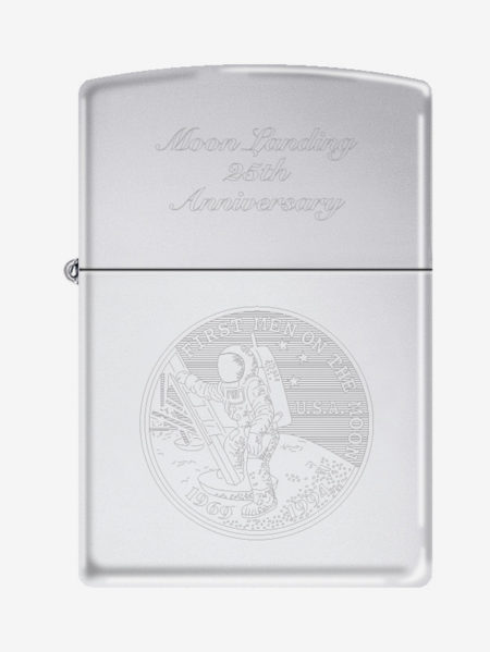 closeup of a silver zippo with a man walking on the moon engraved