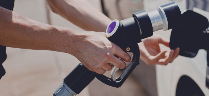 Hand holding hydrogen pump.