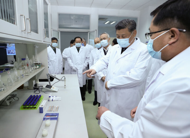 Chinese President Xi Jinping learns about the progress on a COVID-19 vaccine during his visit to the Academy of Military Medical Sciences in Beijing on March 2, 2020. 