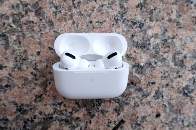 Apple's AirPods Pro inside an open case.