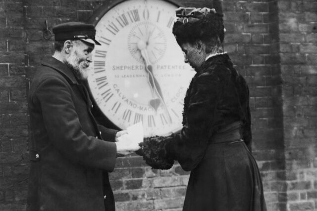 Elizabeth Ruth Belville receives a timekeeping certificate from an official at the Royal Greenwich Observatory, circa 1903.