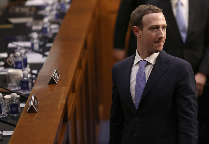 Facebook co-founder, chairman, and CEO Mark Zuckerberg departs after testifying before a combined Senate Judiciary and Commerce Committee hearing in the Hart Senate Office Building on Capitol Hill, April 10, 2018, in Washington, DC. 