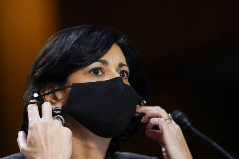 Rochelle Walensky, director of the US Centers for Disease Control and Prevention (CDC), adjusts her protective mask during a Senate Health, Education, Labor, and Pensions Committee hearing in Washington, DC. Susan Walsh/AP/Bloomberg via Getty Images