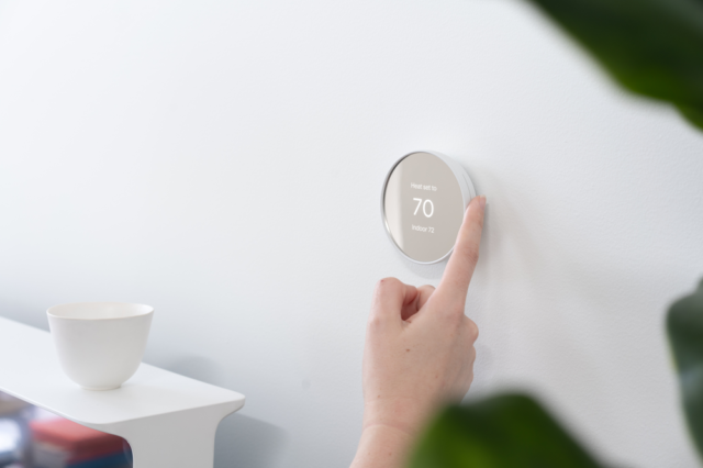 The Google Nest Thermostat is operated with a touch-sensitive ring interface.