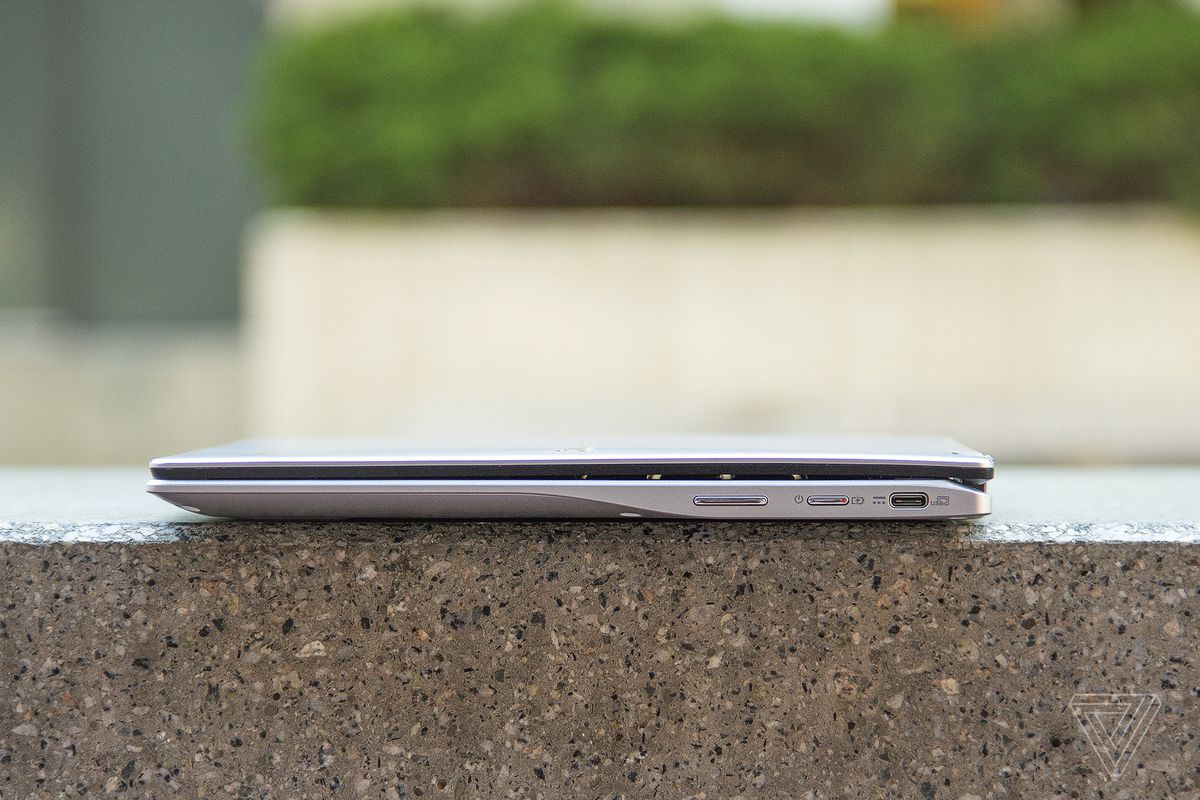 The Acer Chromebook Spin 513 on a stone bench, closed, seen from the right side.