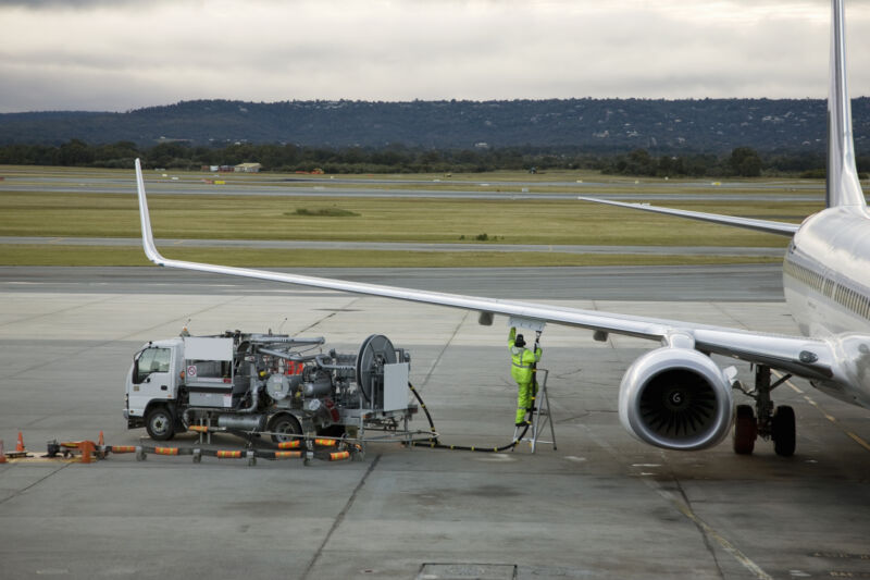 Image of a jet being refueled.