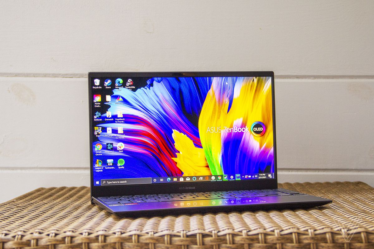 The Asus Zenbook 13 OLED seen from the front, angled to the right.