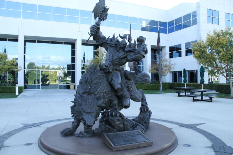 A <>em>Warcraft</em>-themed statue sites in front of the Blizzard employee campus.”><figcaption class=