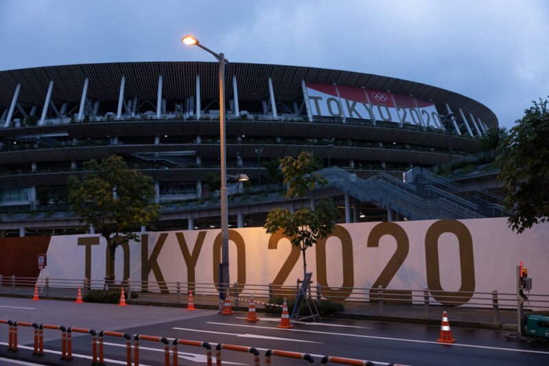 Exterior of a sports arena at dawn or dusk.